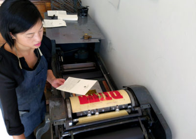 Janine reviewing a new print.