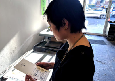 Janine examining print.
