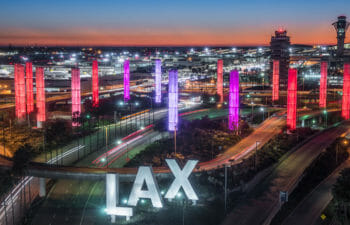 Aerial view of Los Angeles Airport Gateway with large purple and red lights