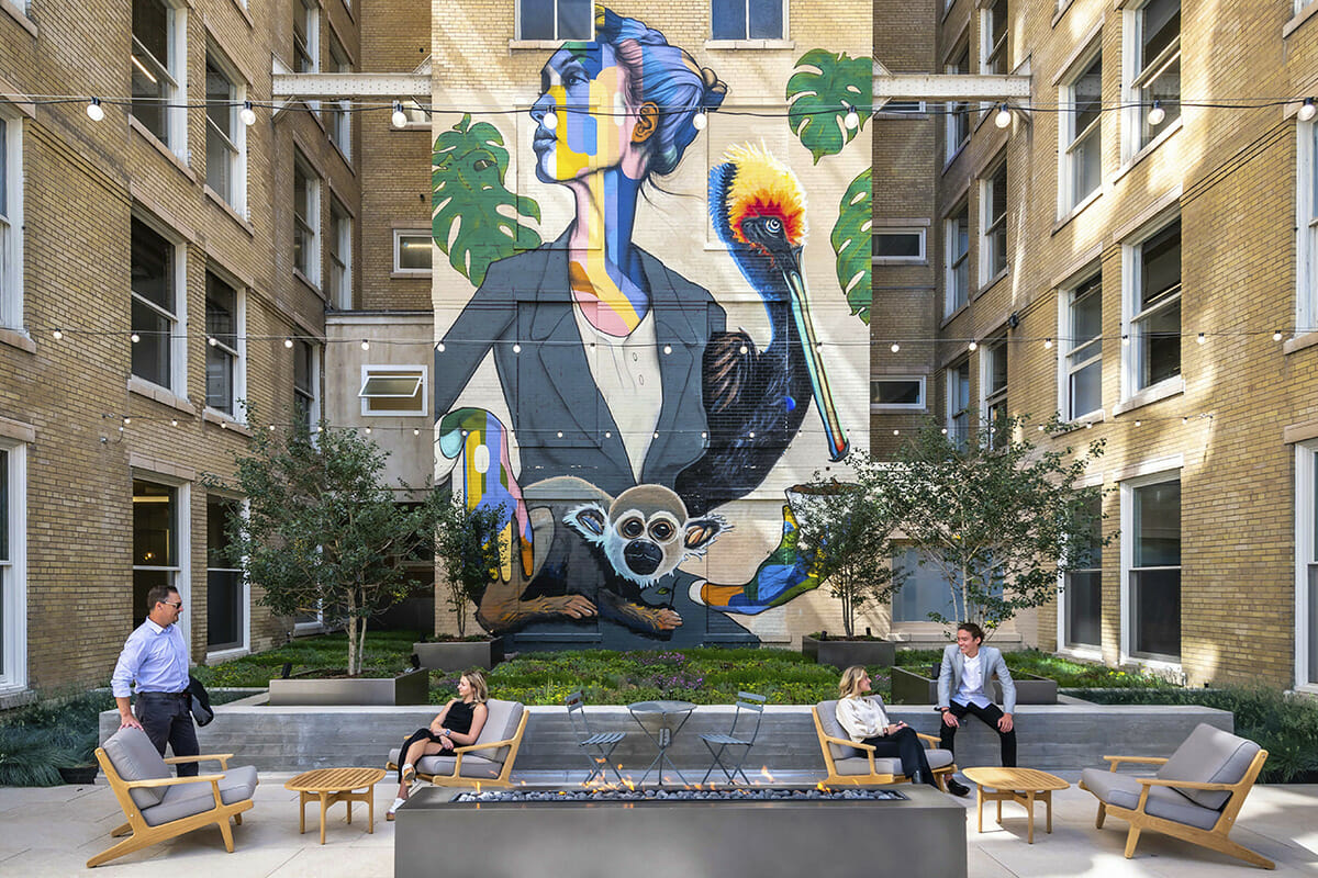 Photo of a courtyard with a mural