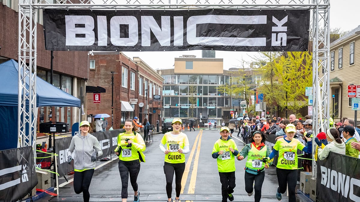 Bionic 5k race competitors cross the finish line.