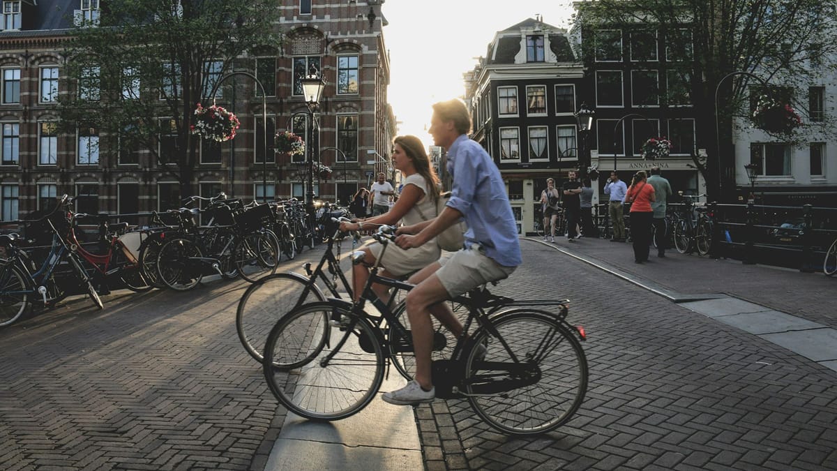 Photo of two people on bicycle